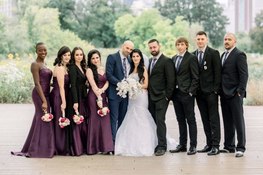 wedding party next to bride and groom